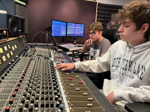 students at recording console