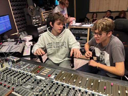students at the recording console